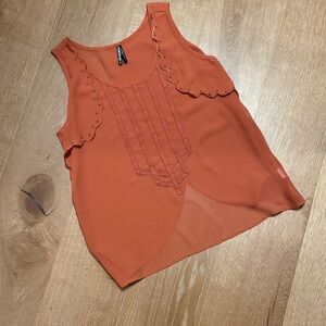 Gentle Fawn Orange Sleeveless Top with Lace And Brass Studs Detailing